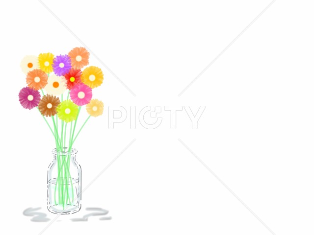 素朴なガラス瓶に生けた名も無き野の花